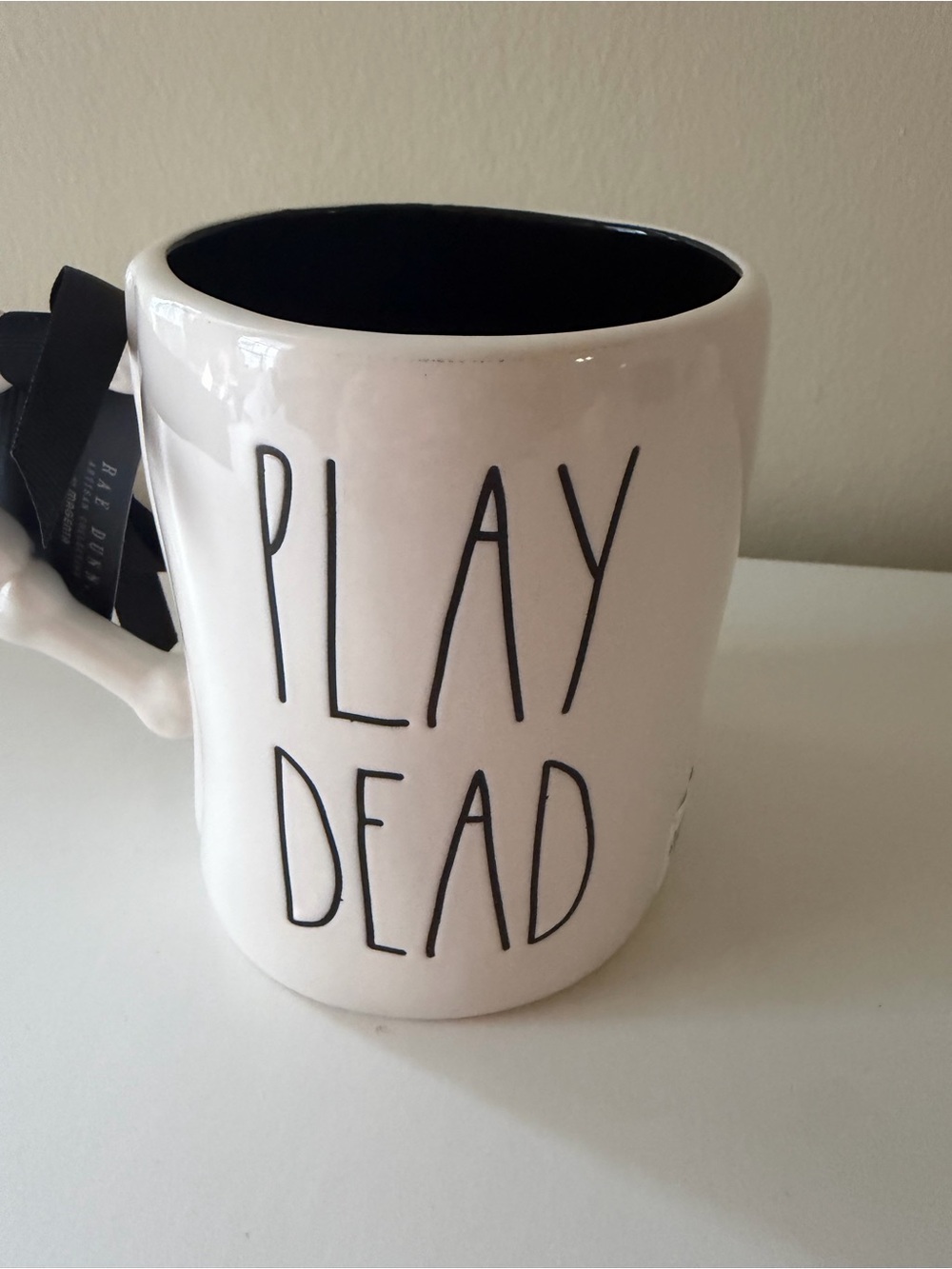 Rae Dunn White Ceramic Mug with Black Interior and Artwork - Picture 2 of 3